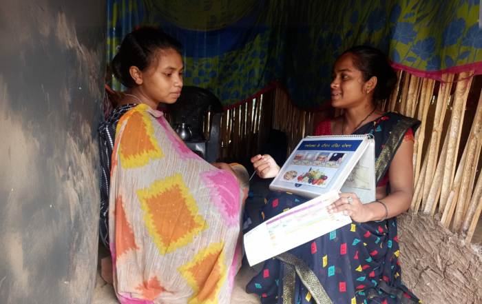 Mary with a community health volunteer